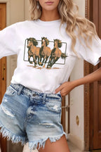 White western graphic tee featuring three horses running. Cuffed sleeves, relaxed cowgirl style for rodeo-ready and everyday ranch-inspired outfits.