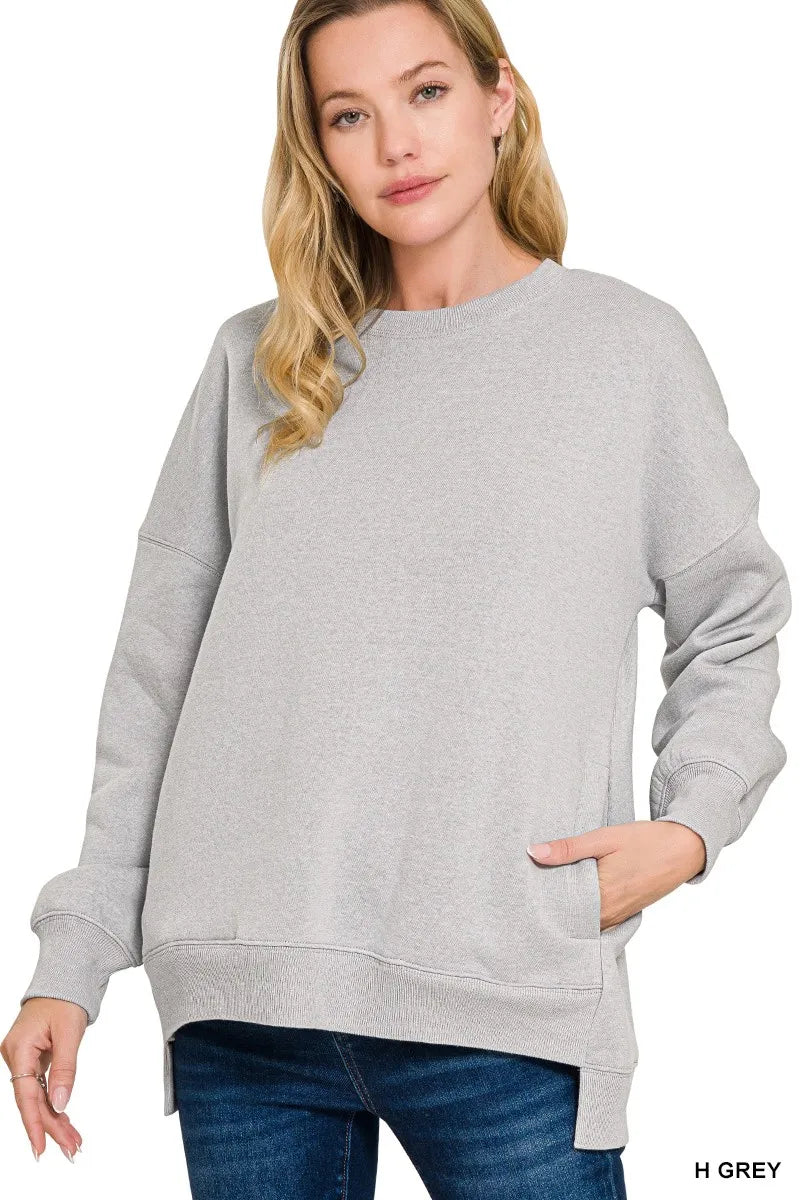 Women’s gray fleece hi-low boyfriend sweatshirt with pockets, ultra-soft cozy fabric, relaxed casual fit for everyday layering and comfort wear.